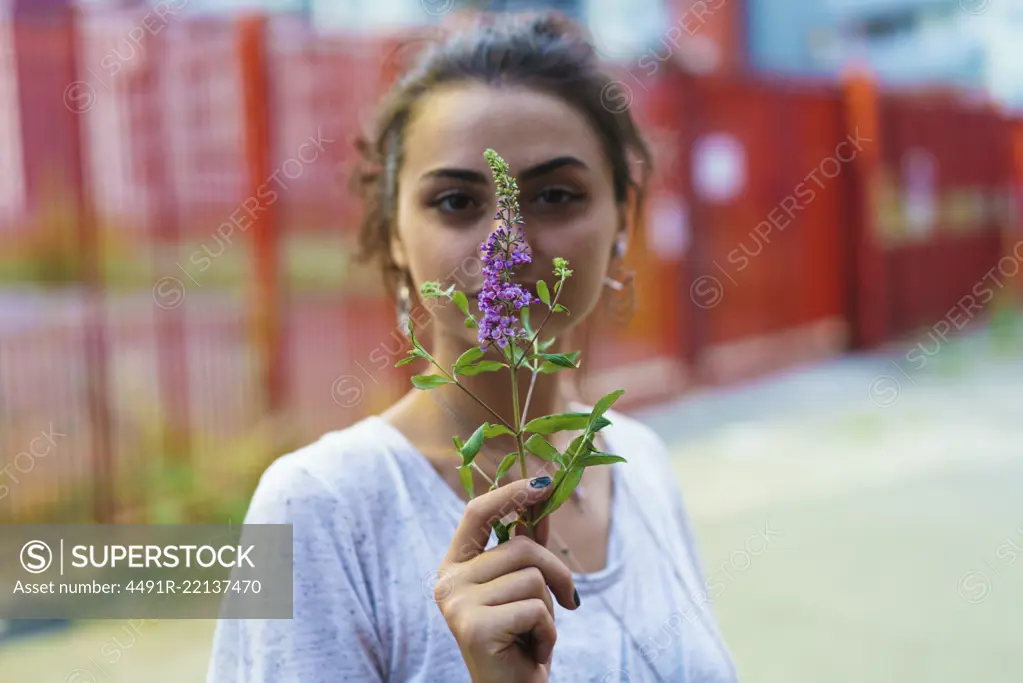 Woman holding blooming twig