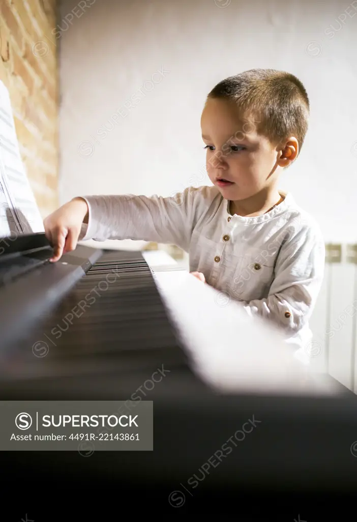 Boy playing piano