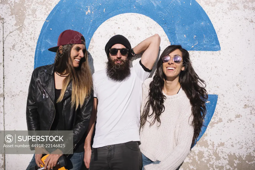 Group of friends frolic in the street