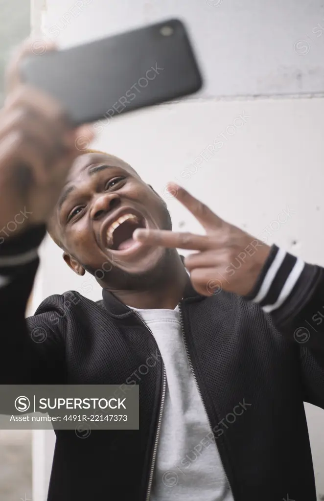 African american man making himself selfie portrait of smart phone