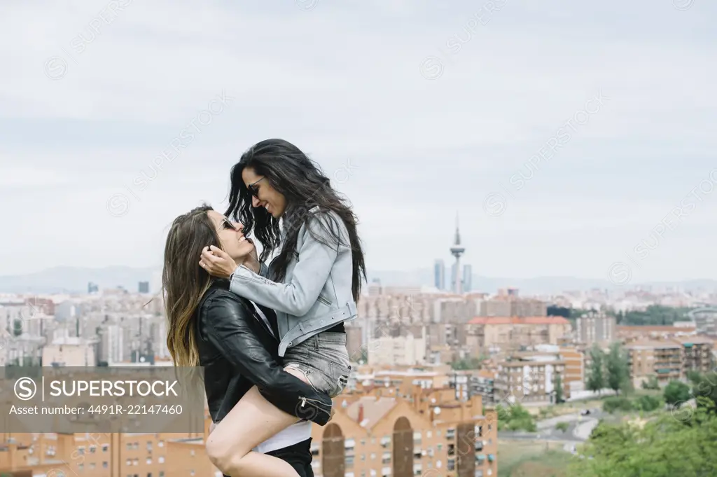 An attractive young lesbian couple on a street 