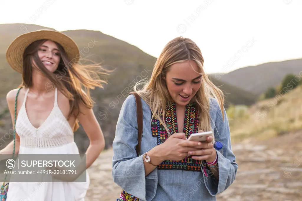 Women tourists with phone