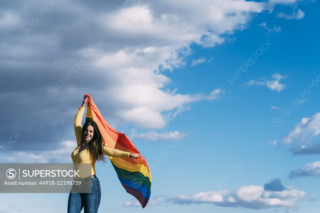 Young woman with gay flag