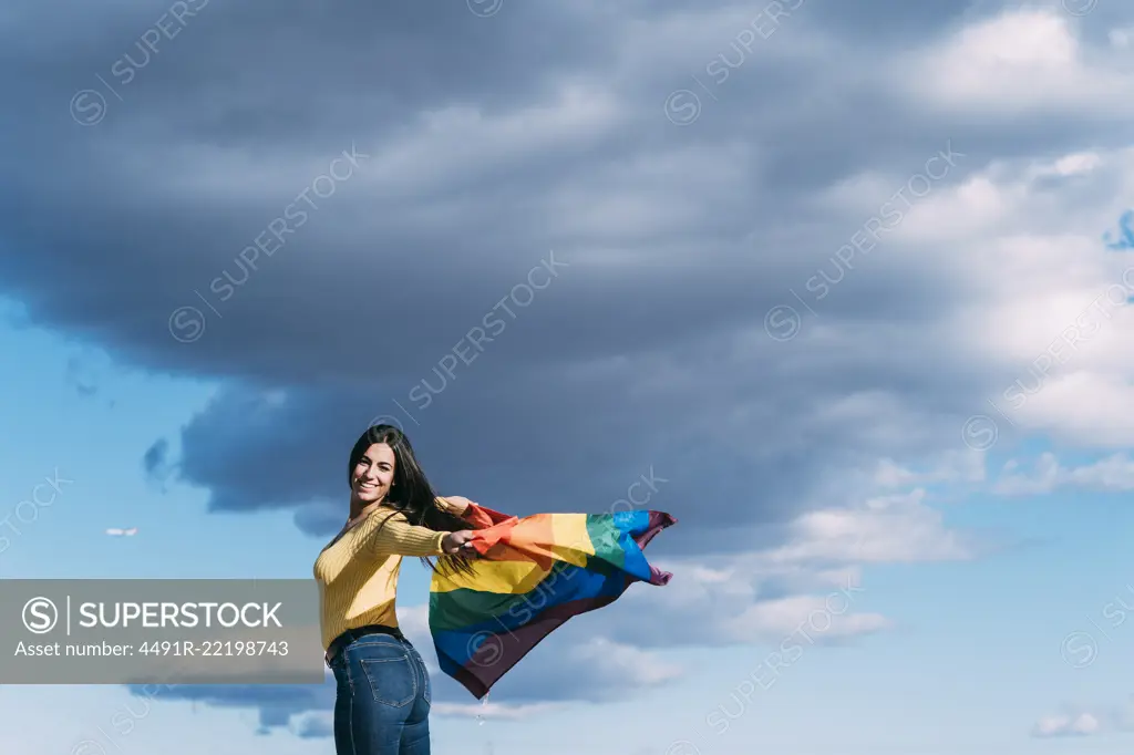 Young woman with gay flag