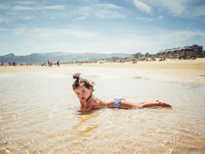 little girl by the seashore
