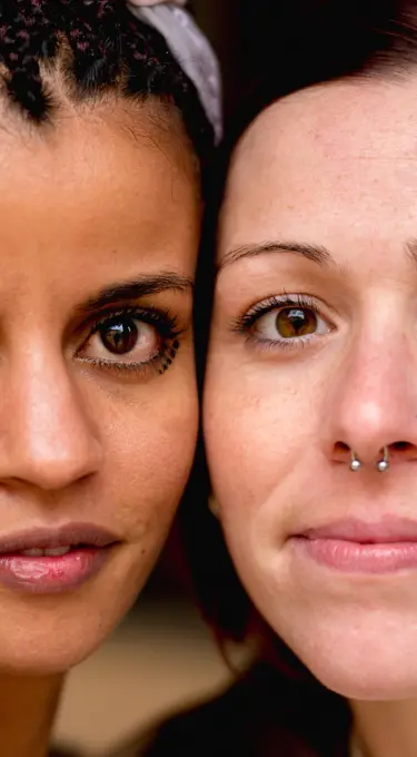 Portrait of crop multiethnic stylish women with earring looking at camera ;Mysterious multiracial women thoughtful looking at camera