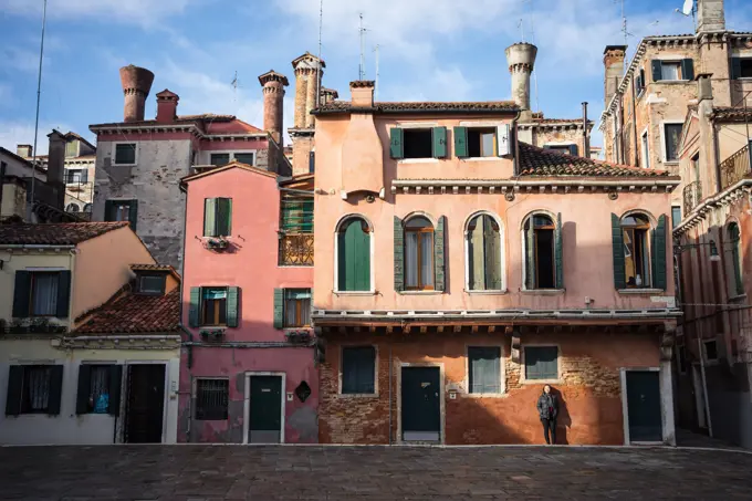 Colorful ancient buildings with narrow alleys on empty city street and blue sky on background;Old buildings on city street