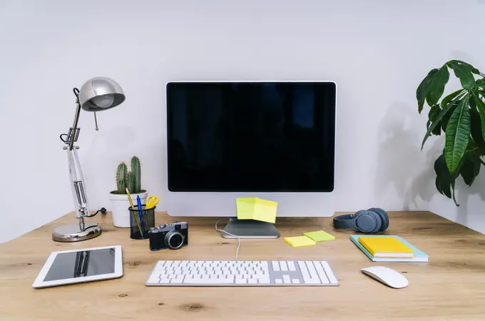 Modern creative home workspace with computer