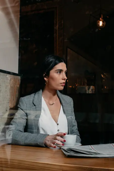 close-up of a woman behind a window