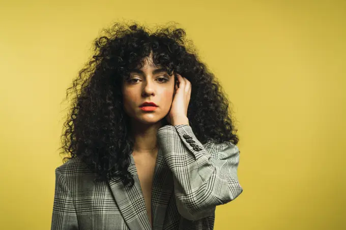 Curly woman in studio