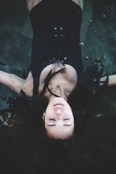 Woman relaxing and swimming