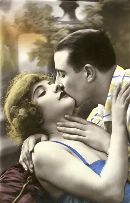 Close-up of a young man kissing a young woman