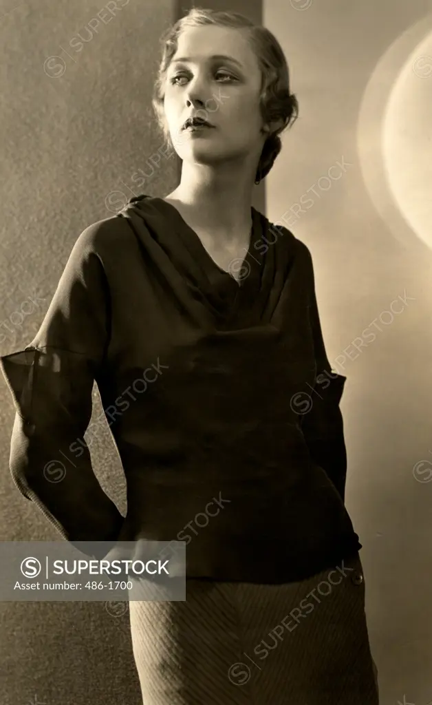 Studio shot of young woman wearing blouse