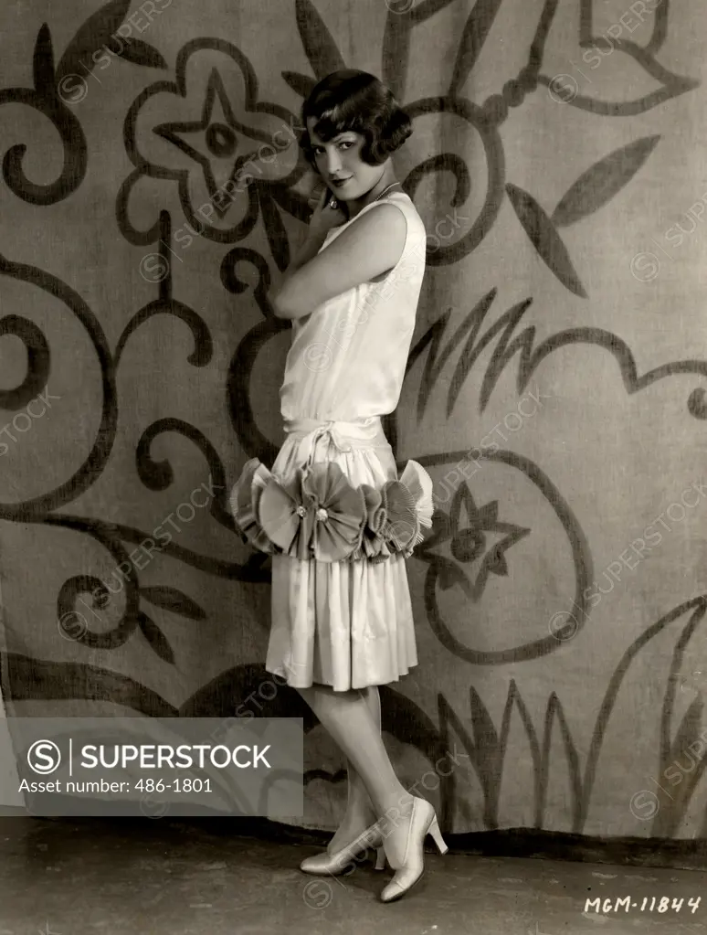 Fashion model posing in frilly dress