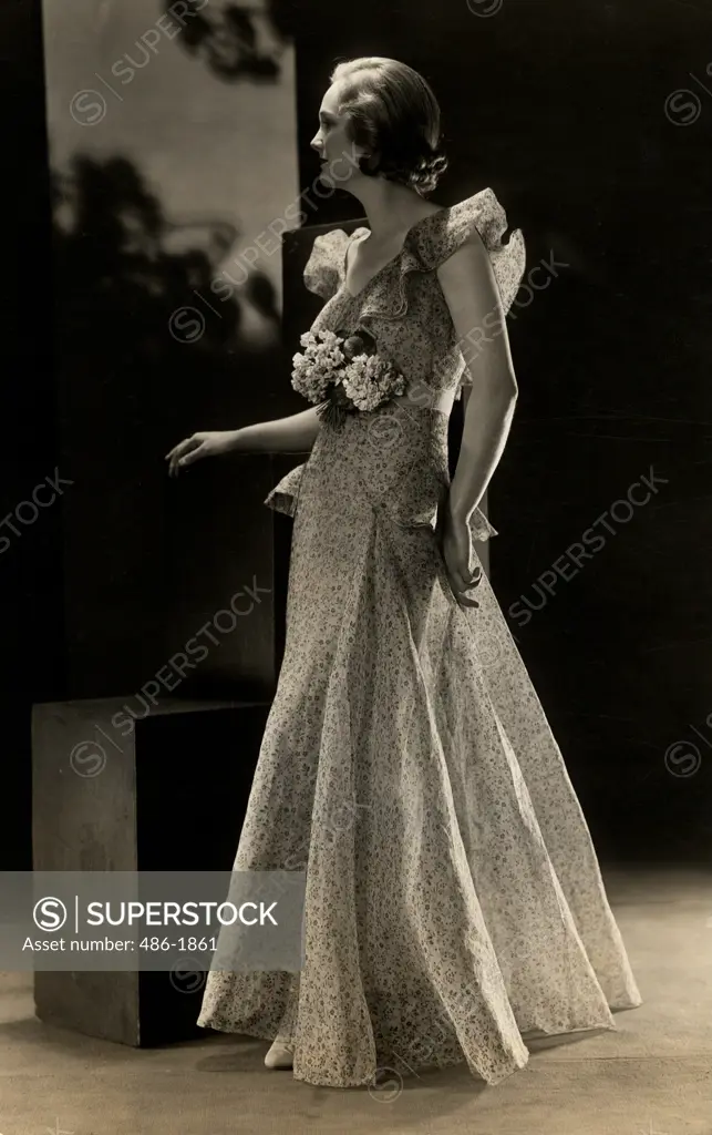 Studio shot of fashion model posing in elegant clothing