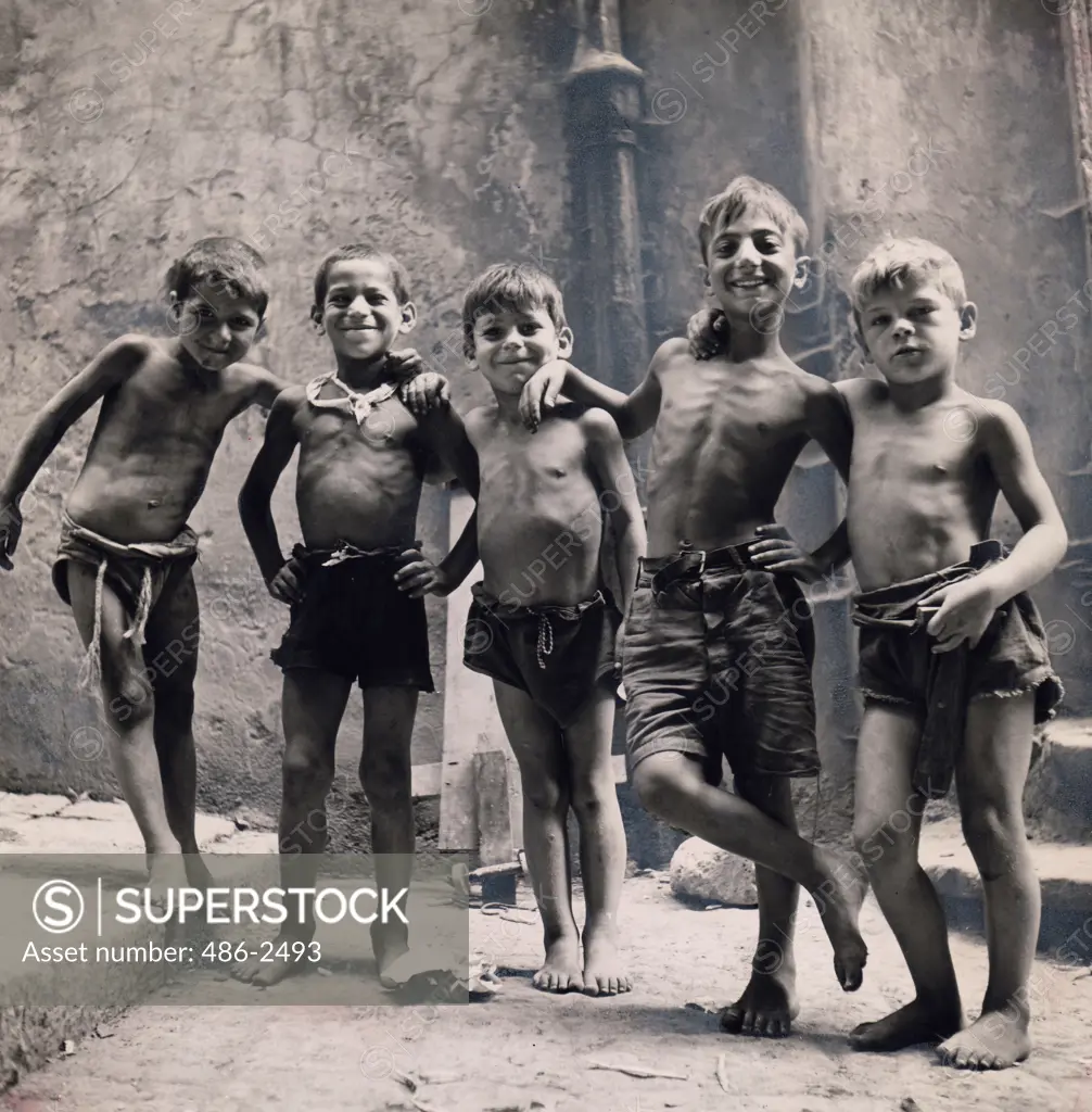 Italy, Naples. Group of boys posing on street