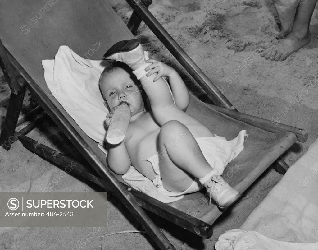 Portrait of baby boy on deckchair