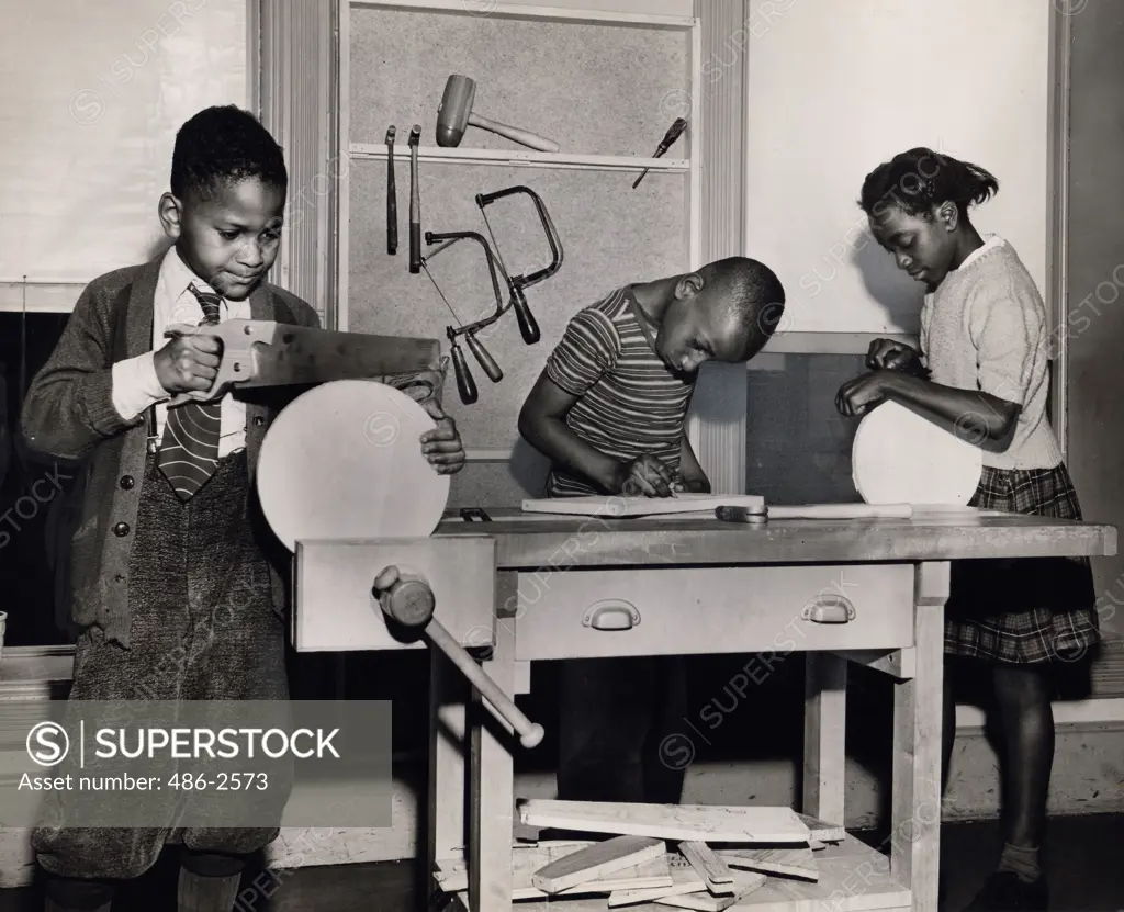 View of boys and girl in workshop