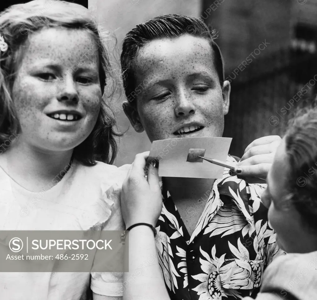 Portrait of freckled girl and boy