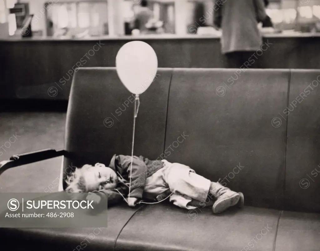 Boy sleeping on sofa