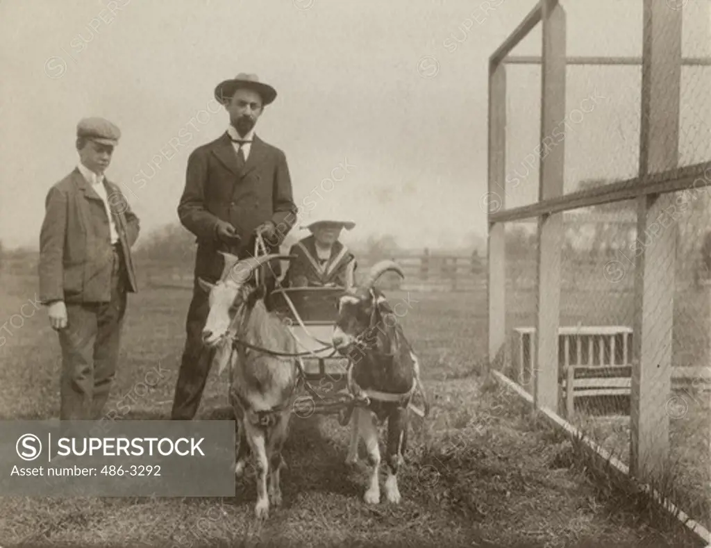 Father with sons and goat carriage