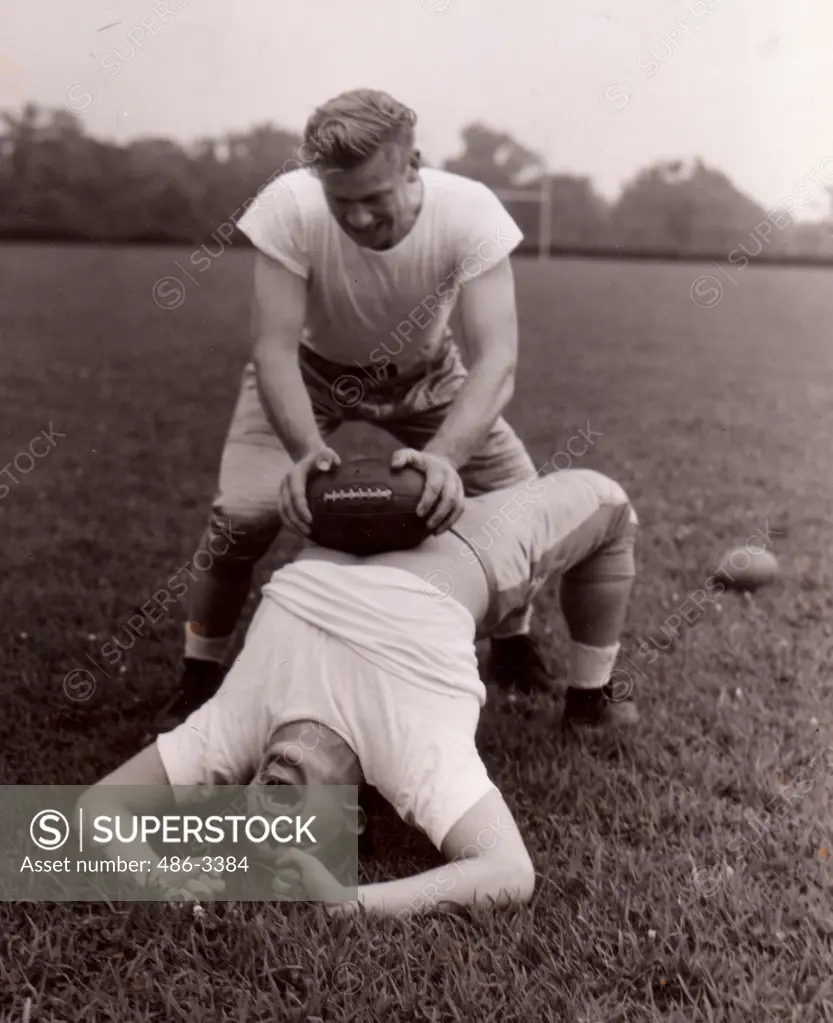 Steve Filipowicz getting some of kinks rubbed off breadbasket by George Cheverko, Steve Filipowicz, All American passer and veteran backfield star, is getting some of the kinks rubbed off the breadbasket by George Cheverko, the back who flashed as a scoring sophomore last Fall.