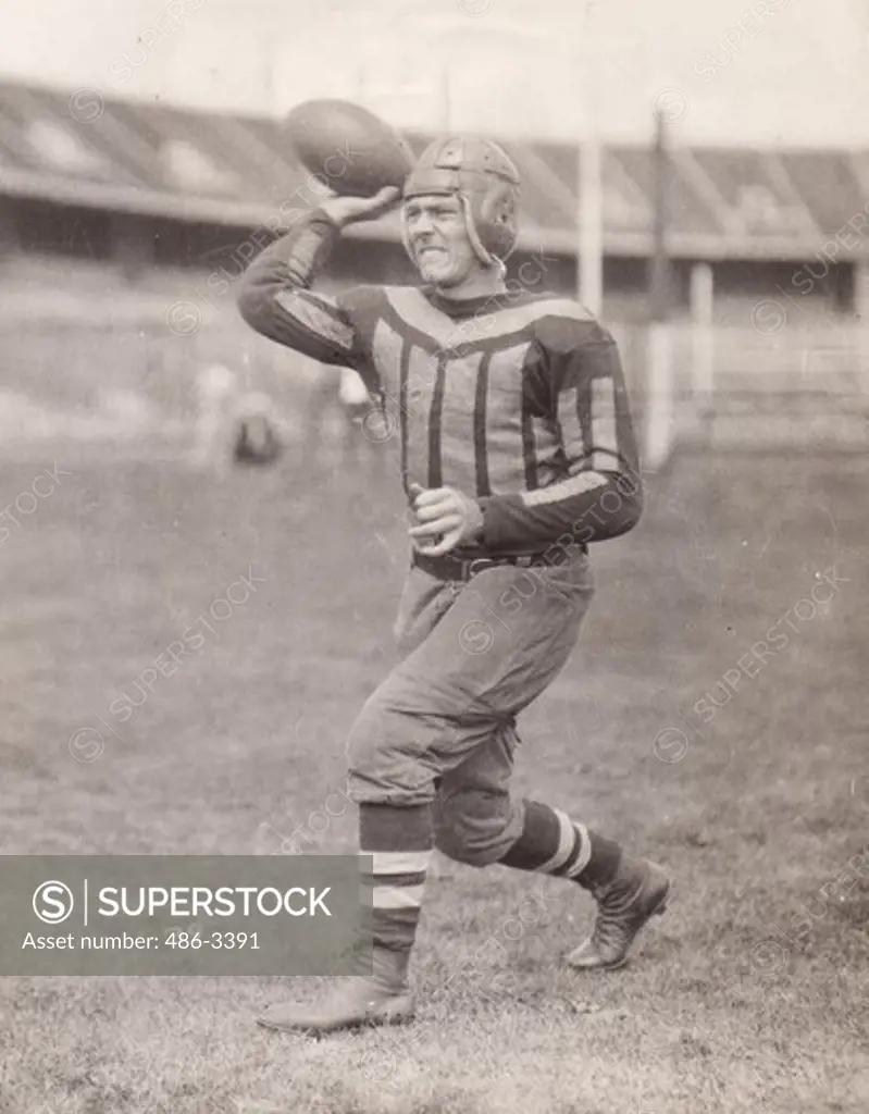 Portrait of American football player throwing football