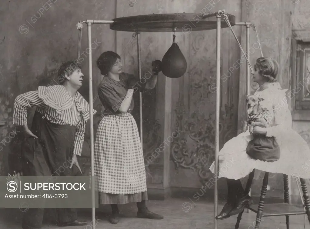 Woman practicing boxing with punching bag