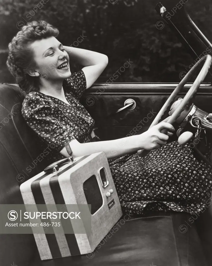 Side profile of a young woman driving a car