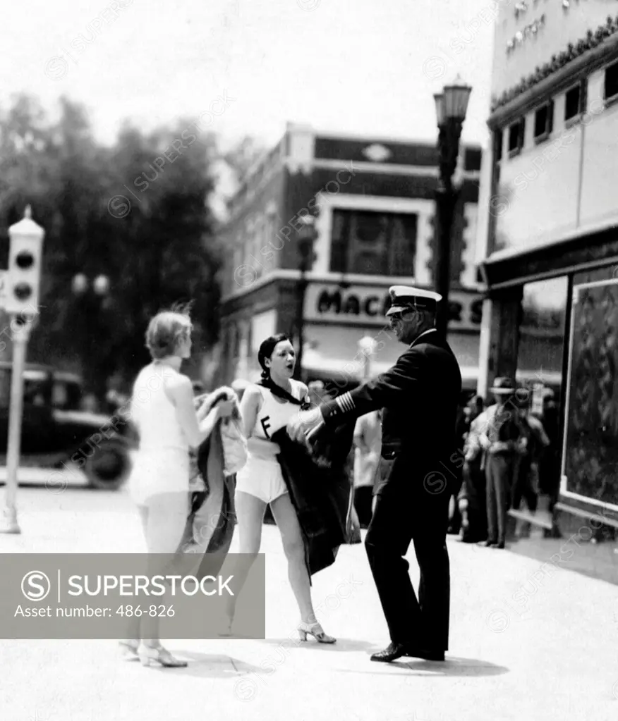 Police officer and women in swimwear