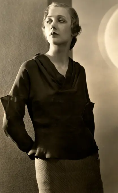 Studio shot of young woman wearing blouse