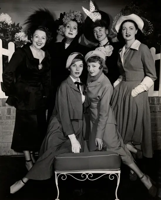 Group of fashion model posing in elegant clothing