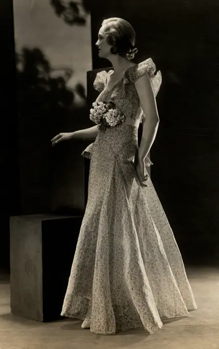 Studio shot of fashion model posing in elegant clothing