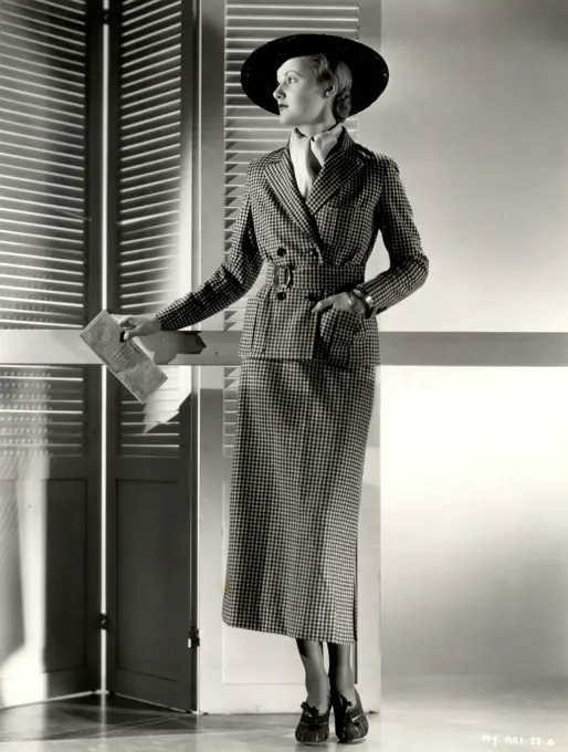 Studio shot of fashion model posing in elegant clothing