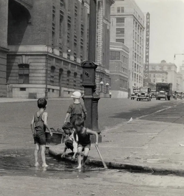 USA, New York City, East Side, Children Playing In Puddle