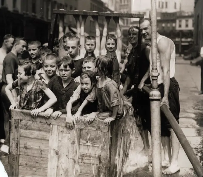 USA, New York City, Swimming Hole In The Middle Of The Street Built By Firemen For West Side Kids