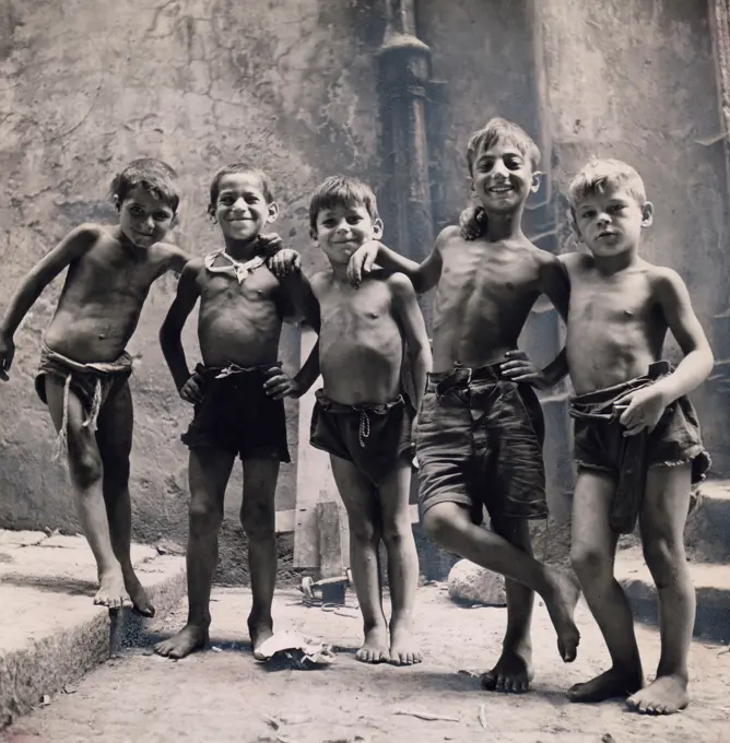 Italy, Naples. Group of boys posing on street