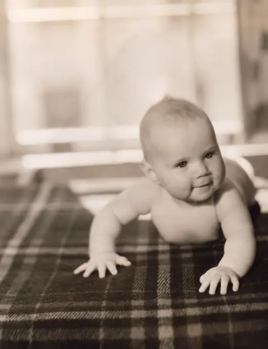 Portrait of baby boy on bed