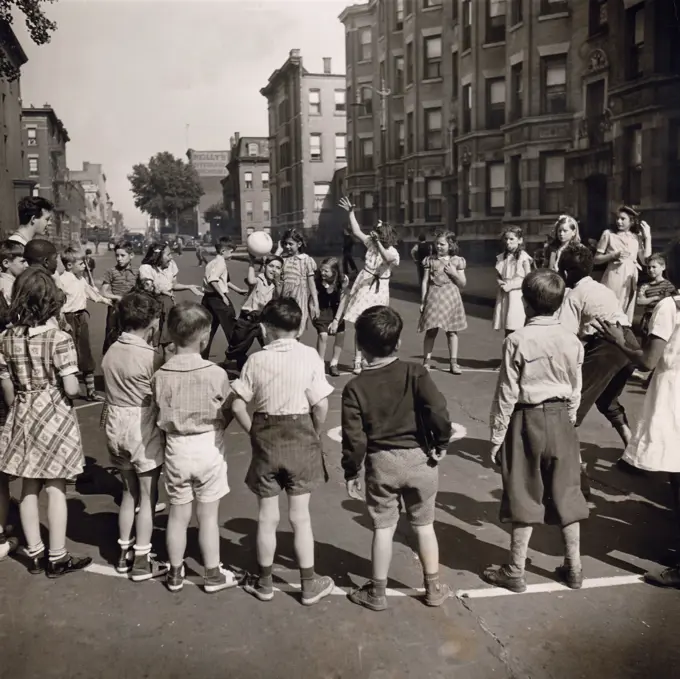 Kids playing ball on street