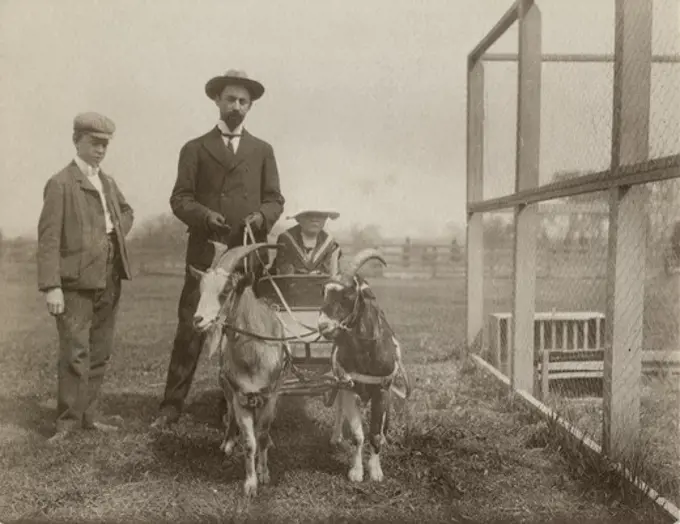 Father with sons and goat carriage