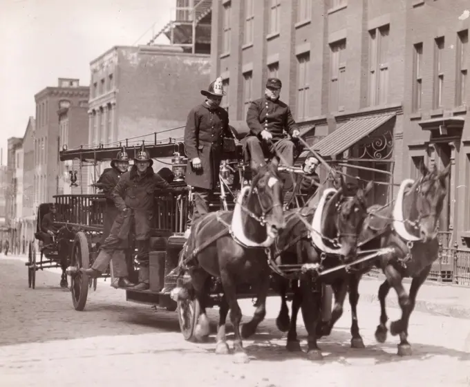 Firemen on old fire engine