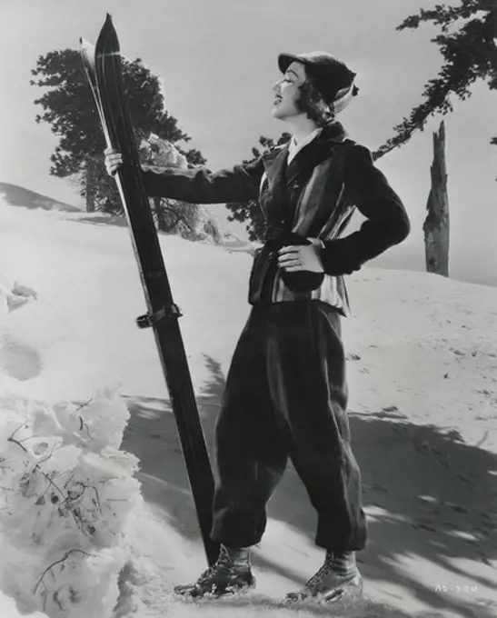 Anne Shirley, RKO Radio star shown in her new skiing outfit of heavy black mackinaw, Durable for all winter sports