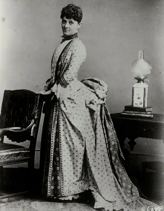 Portrait of fashion model wearing dress from early 1890's