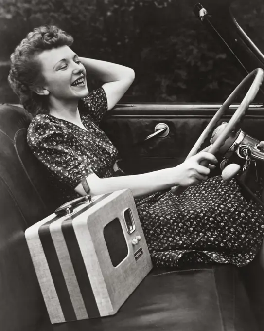 Side profile of a young woman driving a car