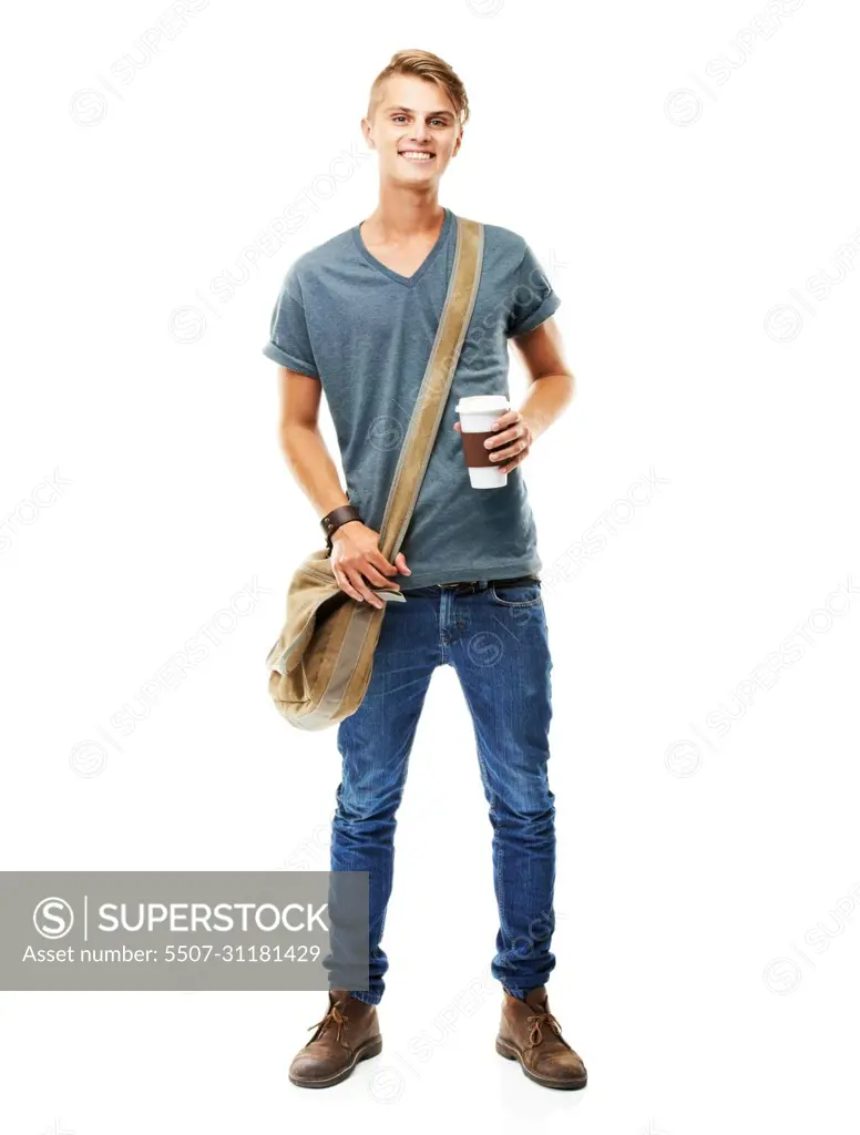 The java keeps me going. A full length studio shot of a young man carying a messengers bag and holding a cup of coffee isolated on white.