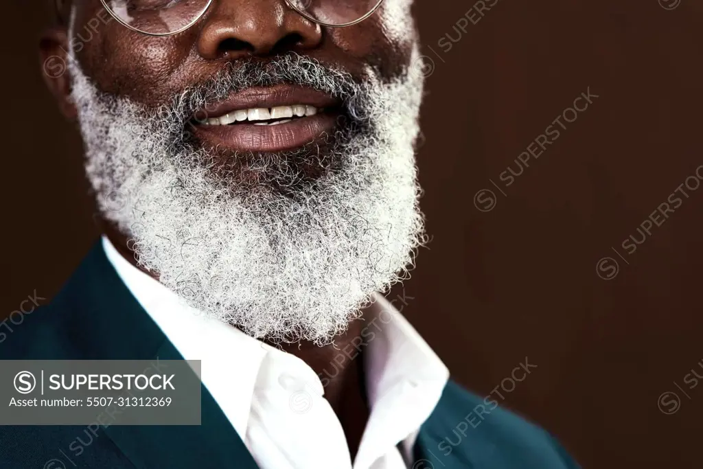 Portrait an attractive middle-aged man with a gray beard. - SuperStock