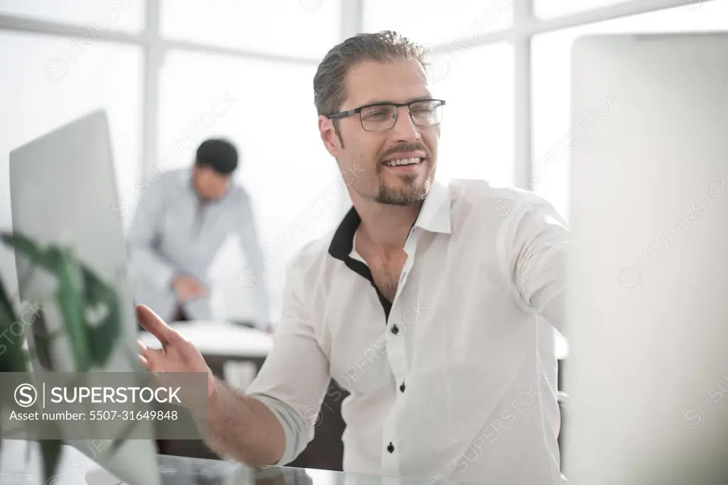 business man working on a personal computer.