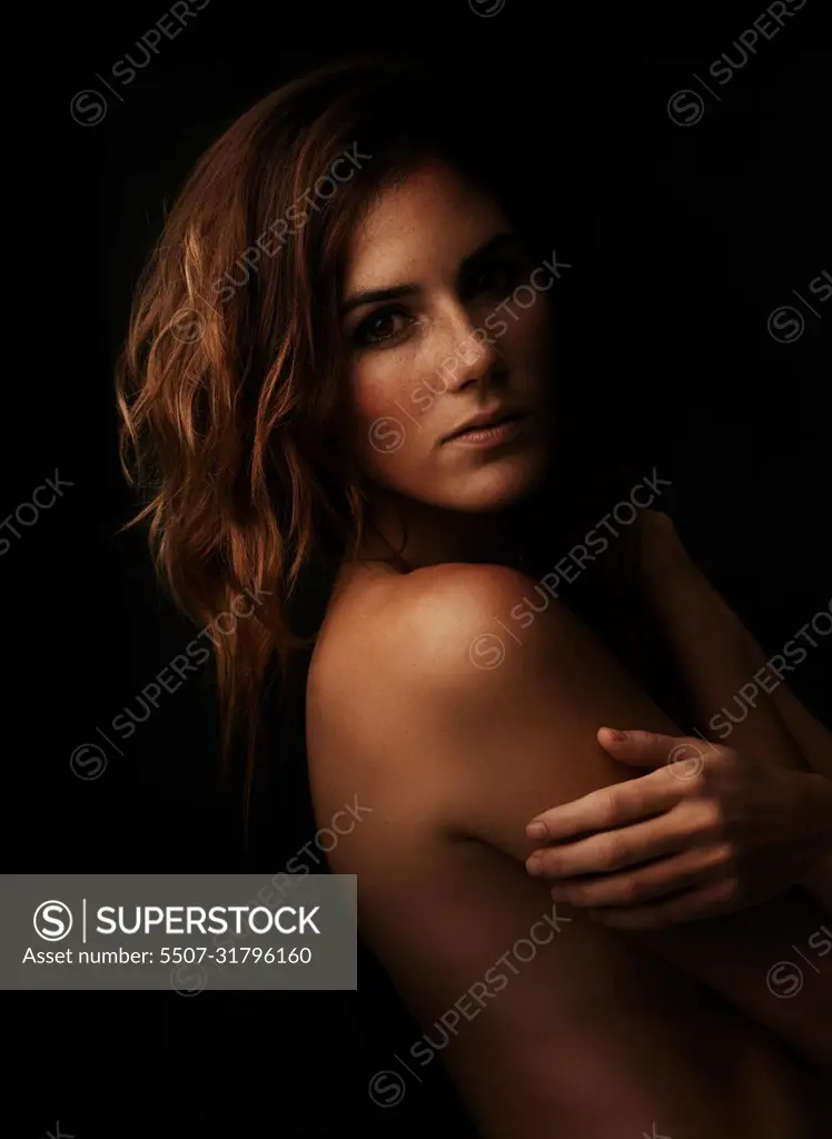 Beautiful Black Ladies Nude - Striking beauty. A beautiful young woman standing naked against a black  background. - SuperStock