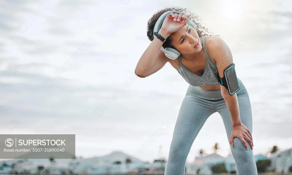 What a way to work up a sweat. Cropped shot of an attractive young female athlete exercising outdoors.