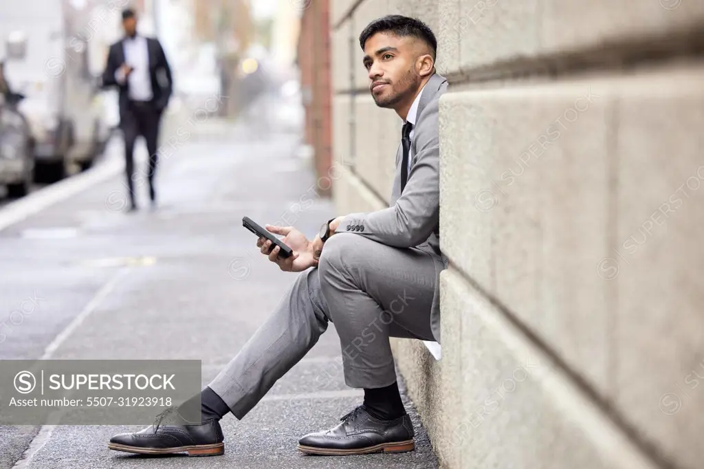 Hes got a lot to think about. Full length shot of a handsome young businessman traveling through the city on his morning commute into work.